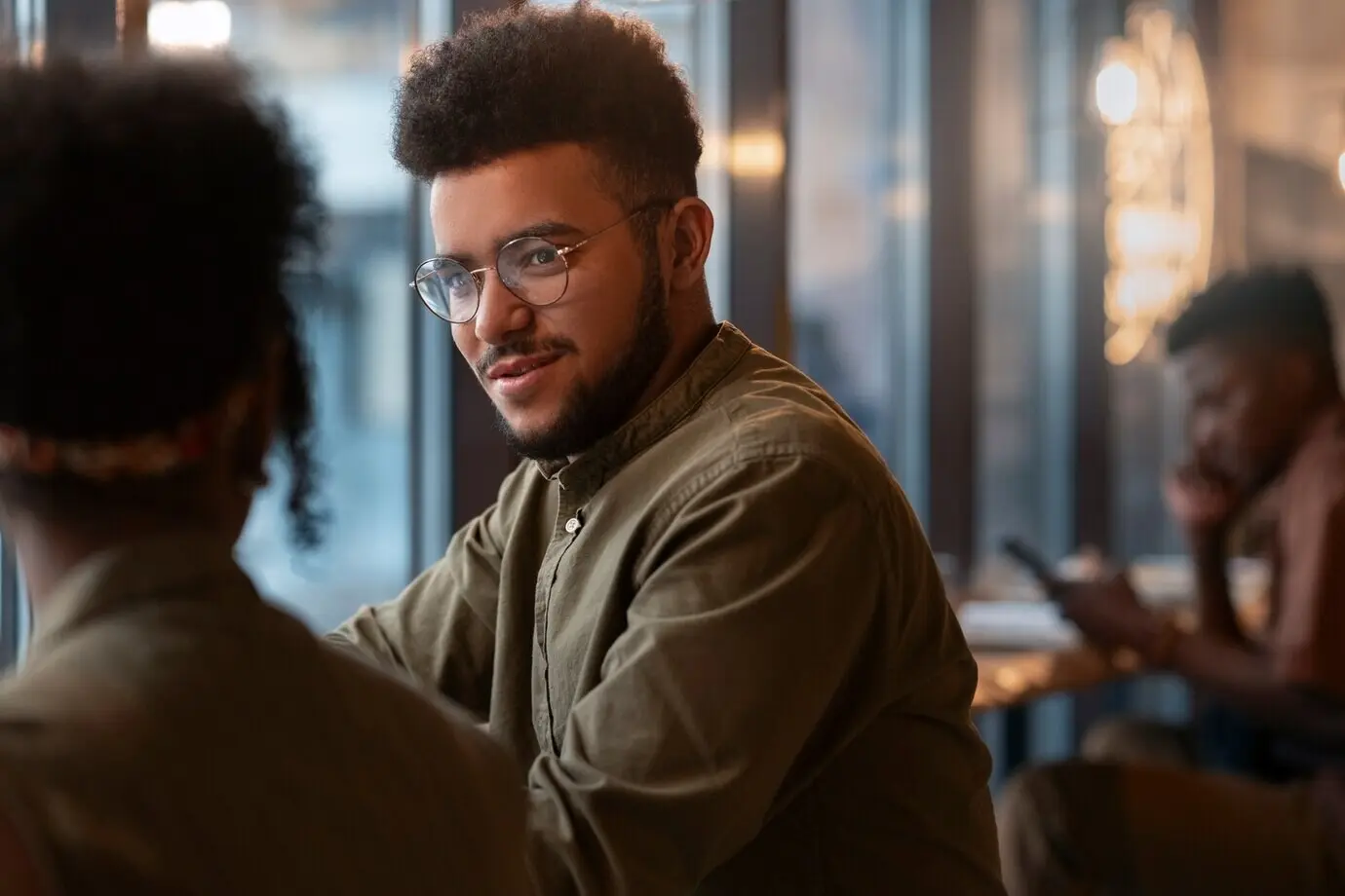 Profile view of Latin friends hanging out